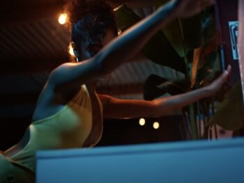 Tyla’s “Water” Music Video Style: Yellow Halter Neck Backless Top Tyla music video fashion